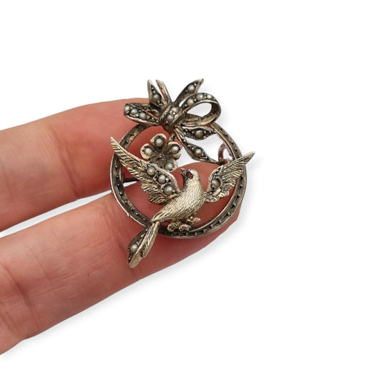 Edwardian silver brooch with bird, bow, pearls and ruby circa 1910