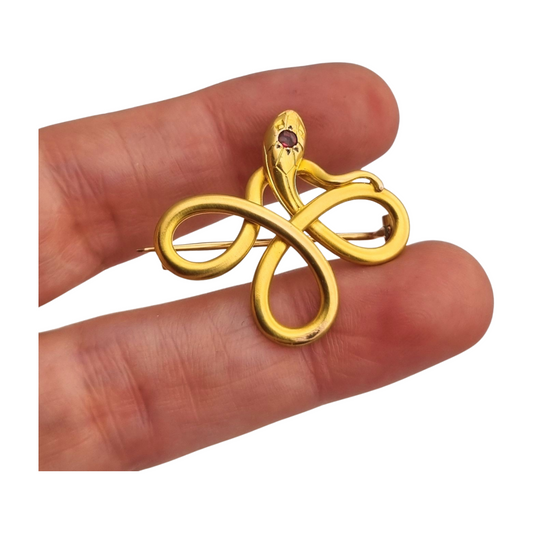 French FIX brooch with intertwined snake, rolled gold and red stone circa 1910
