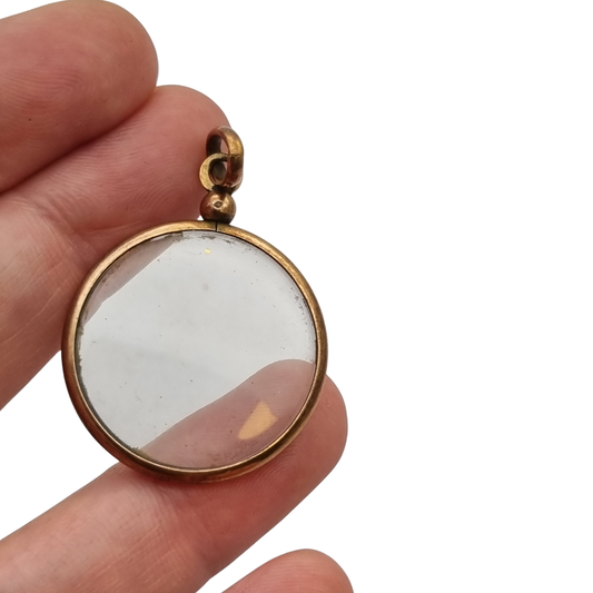 Circular gilded metal and glass locket, antique photo holder, c. 1900