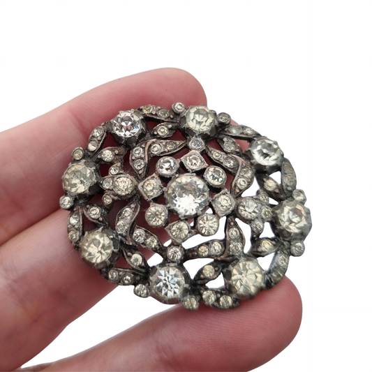 Vintage Art Deco costume jewelry brooch with rhinestones and floral decoration, Hollywood style, Europe, ca. 1940–1950