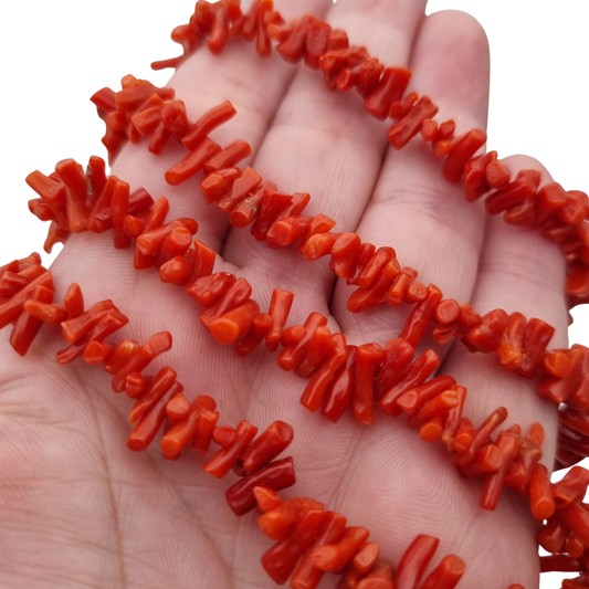 Boho necklace of natural red coral with irregular branches and metal clasp, circa 1970-80
