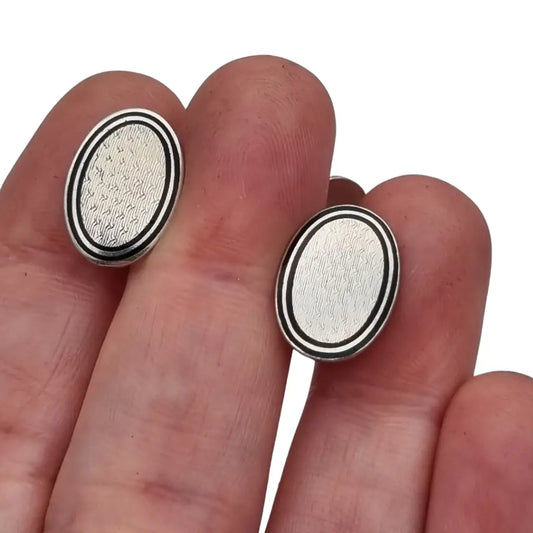 Gemelos antiguos Art Déco ovalados en plata con esmalte y grabado circa