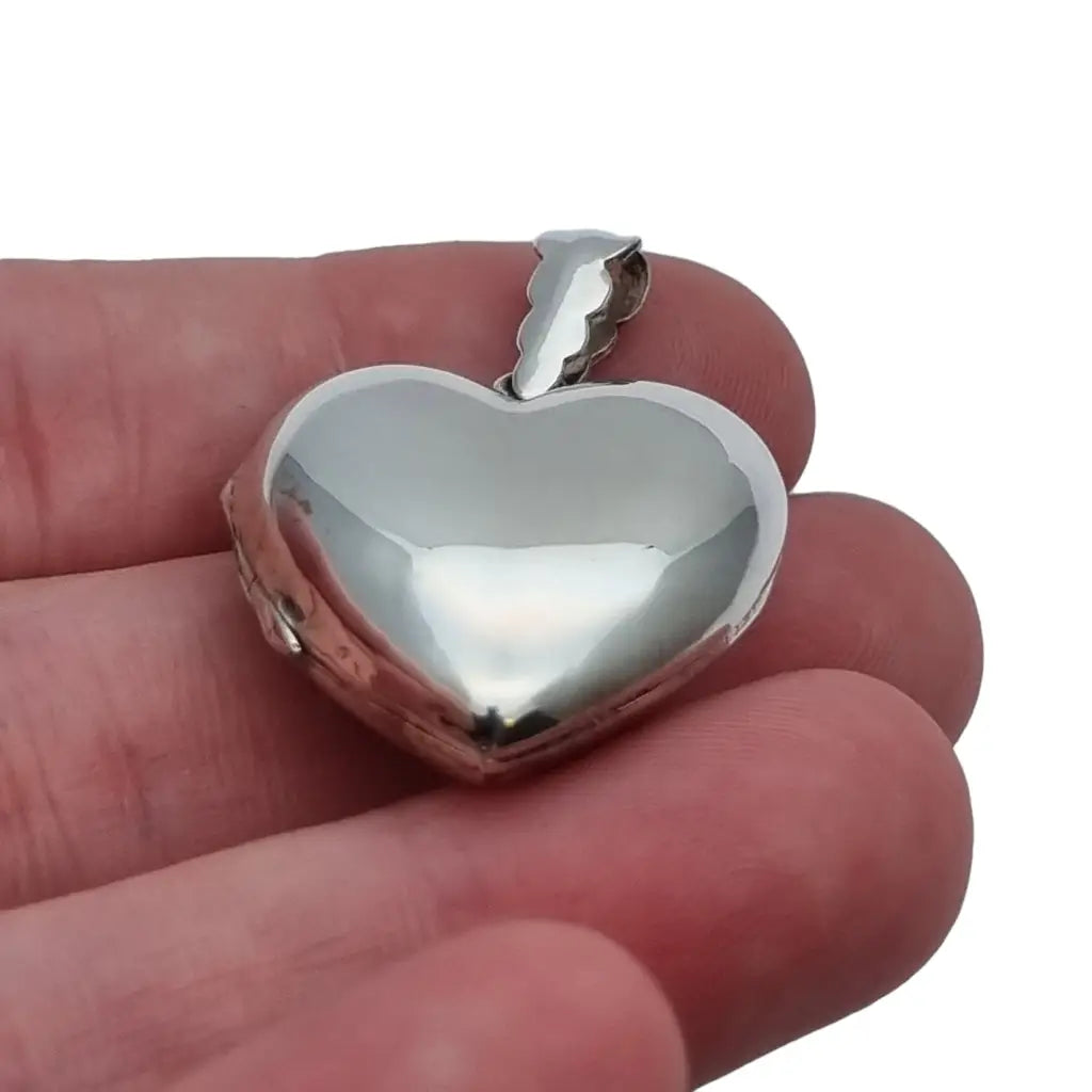 Medallón para fotos de plata y forma corazon.