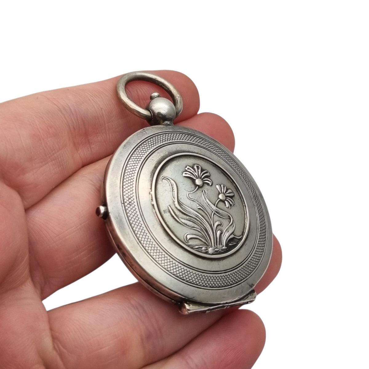 Guardapelo Art Nouveau antiguo de plata 800 con doble portarretrato, grabado floral y piedra rosa, ca. 1900