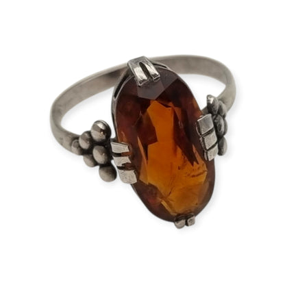 Vintage Art Deco silver ring with cognac-colored glass and geometric decoration, Europe, ca. 1950–1960