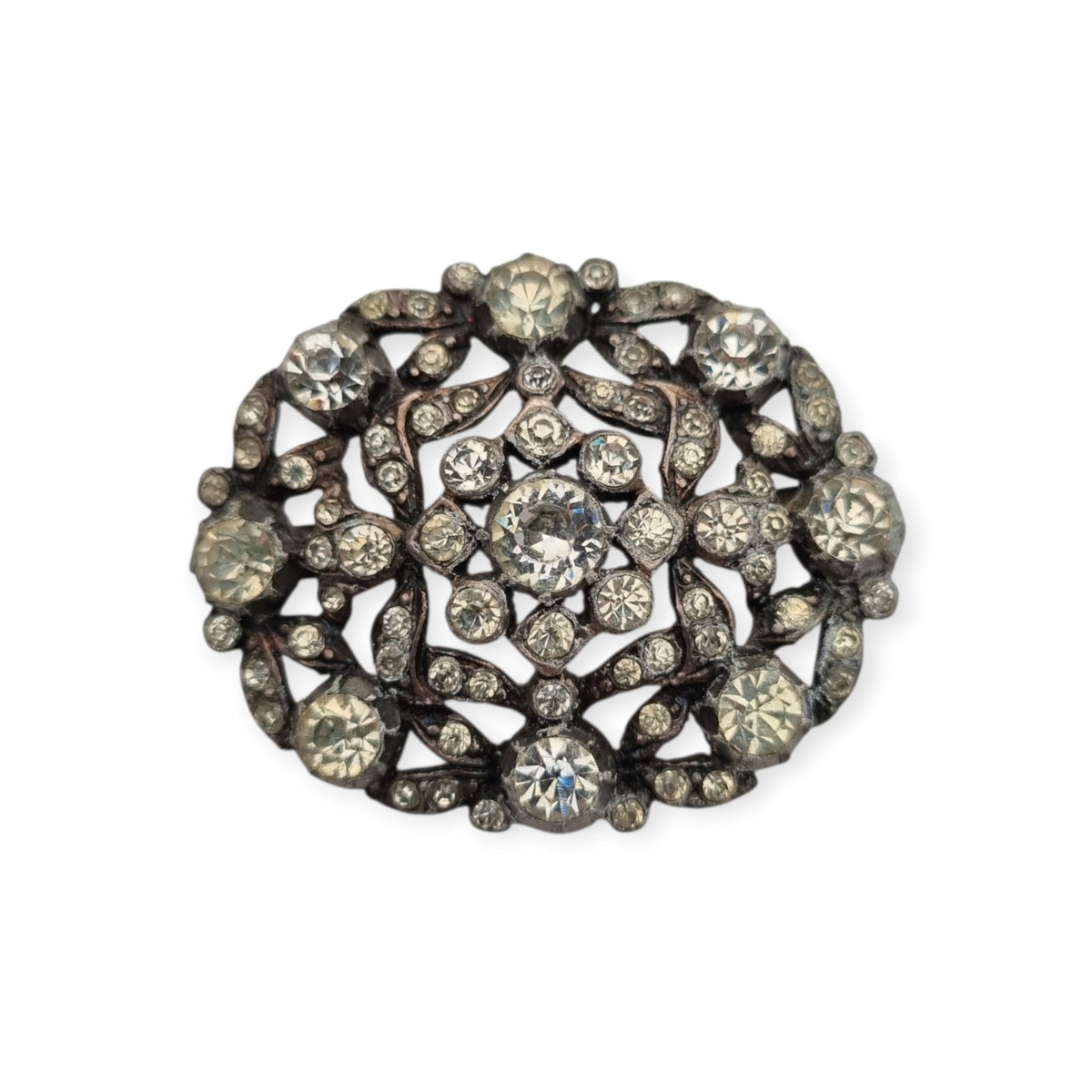 Vintage Art Deco costume jewelry brooch with rhinestones and floral decoration, Hollywood style, Europe, ca. 1940–1950