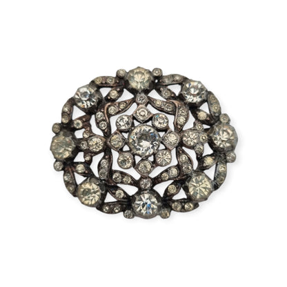 Vintage Art Deco costume jewelry brooch with rhinestones and floral decoration, Hollywood style, Europe, ca. 1940–1950