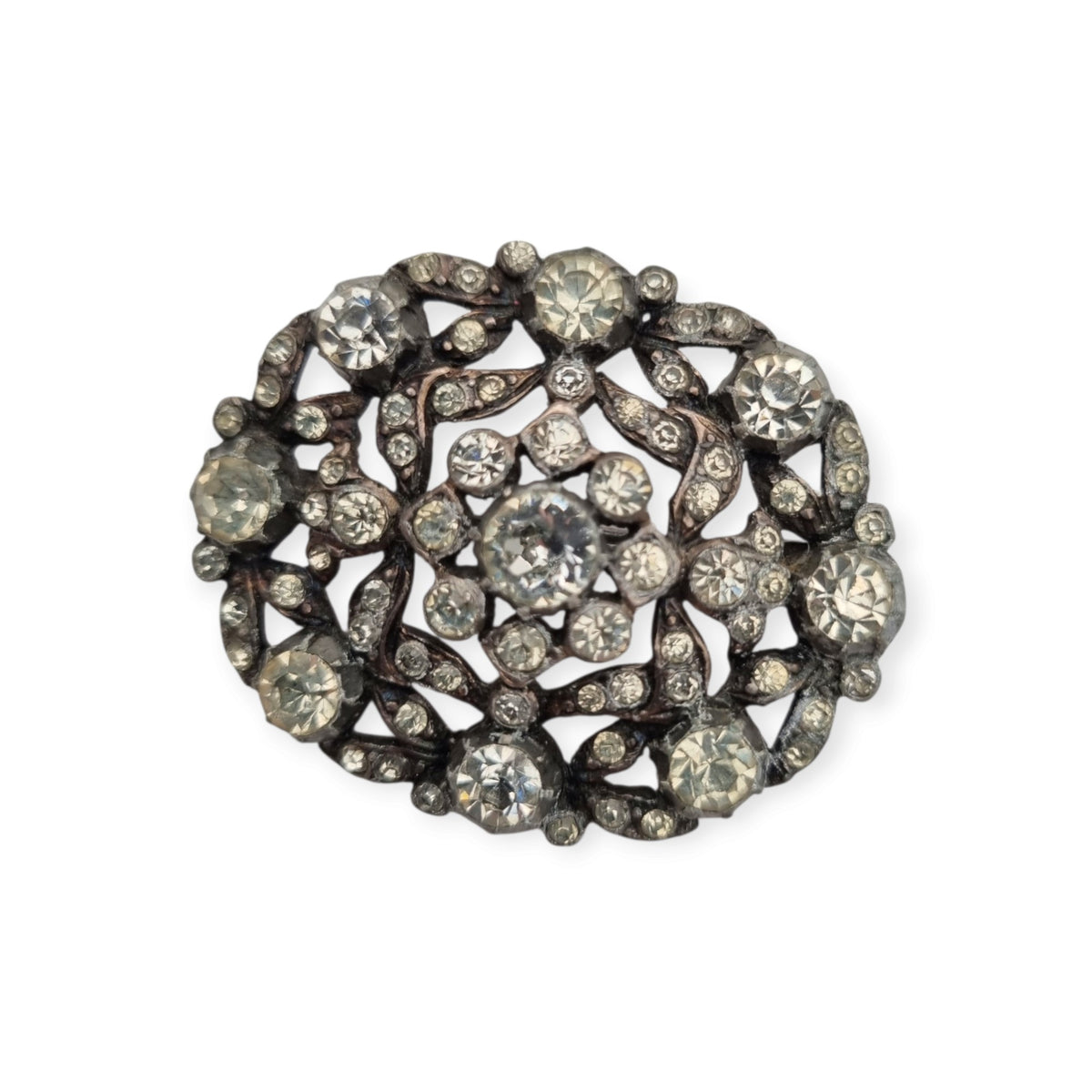 Vintage Art Deco costume jewelry brooch with rhinestones and floral decoration, Hollywood style, Europe, ca. 1940–1950