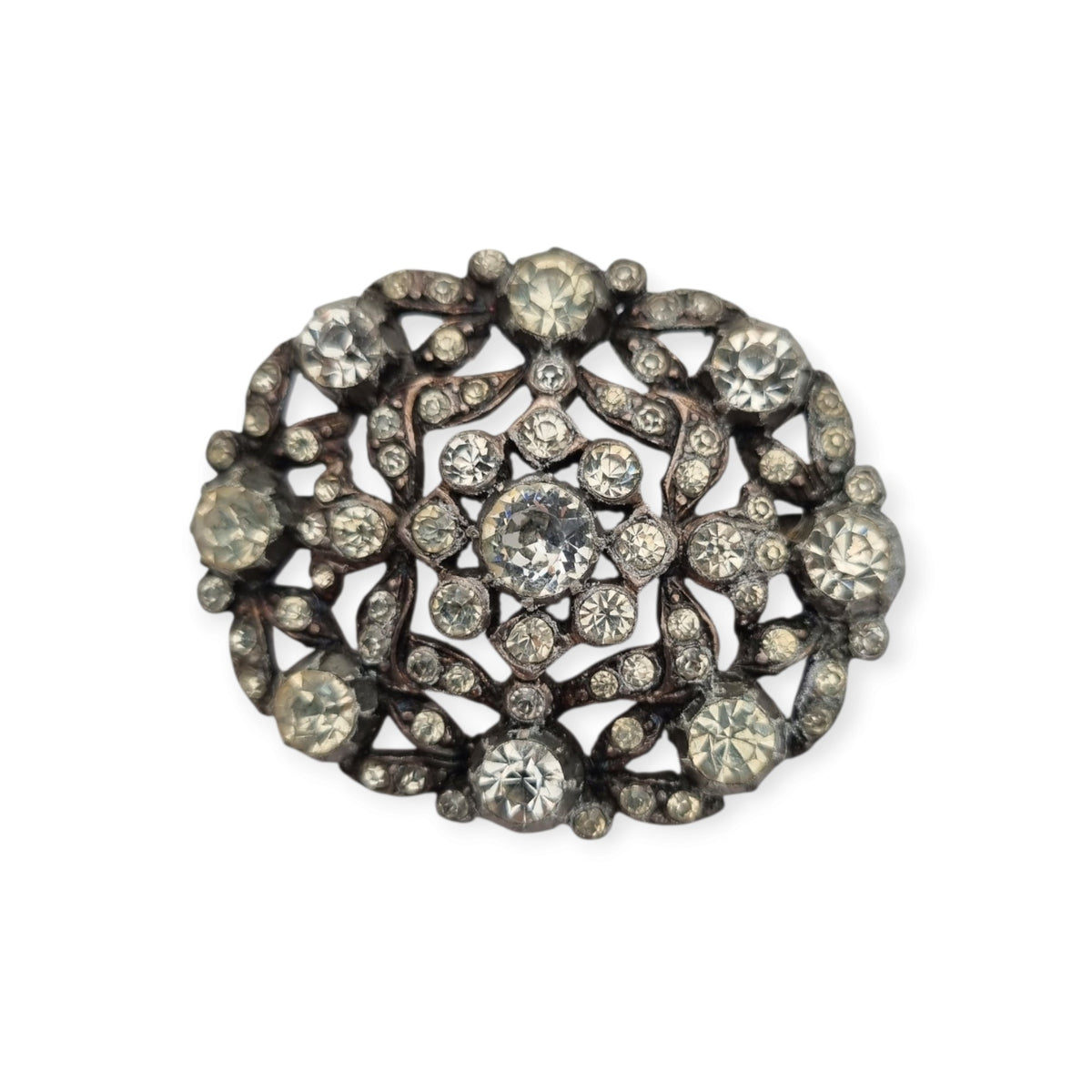 Vintage Art Deco costume jewelry brooch with rhinestones and floral decoration, Hollywood style, Europe, ca. 1940–1950
