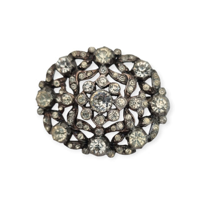 Vintage Art Deco costume jewelry brooch with rhinestones and floral decoration, Hollywood style, Europe, ca. 1940–1950