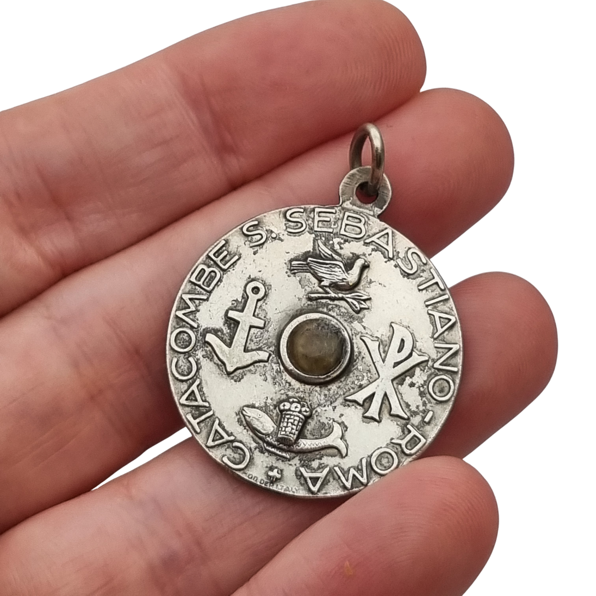 Vintage relic medal of Saint Sebastian from the Catacombs of Rome with early Christian symbols, Italy, ca. 1950–1960