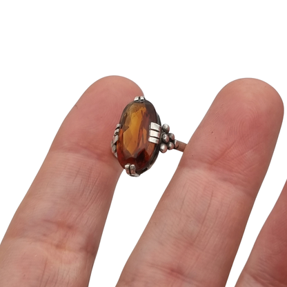 Vintage Art Deco silver ring with cognac-colored glass and geometric decoration, Europe, ca. 1950–1960