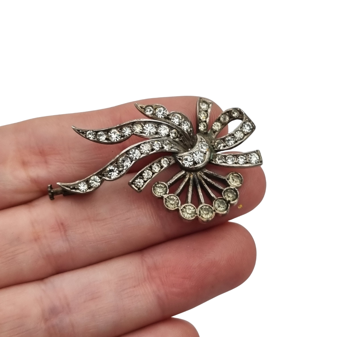 Antique Art Deco silver brooch with floral bouquet and white rhinestone bow circa 1930