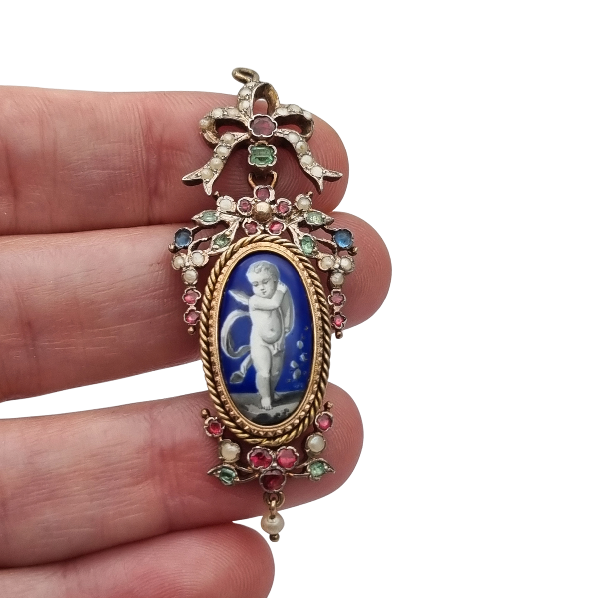 Antique winged cherub pendant in Gilt Silver with Enamel, Pearls, and Gems, ca. 18 70–1890