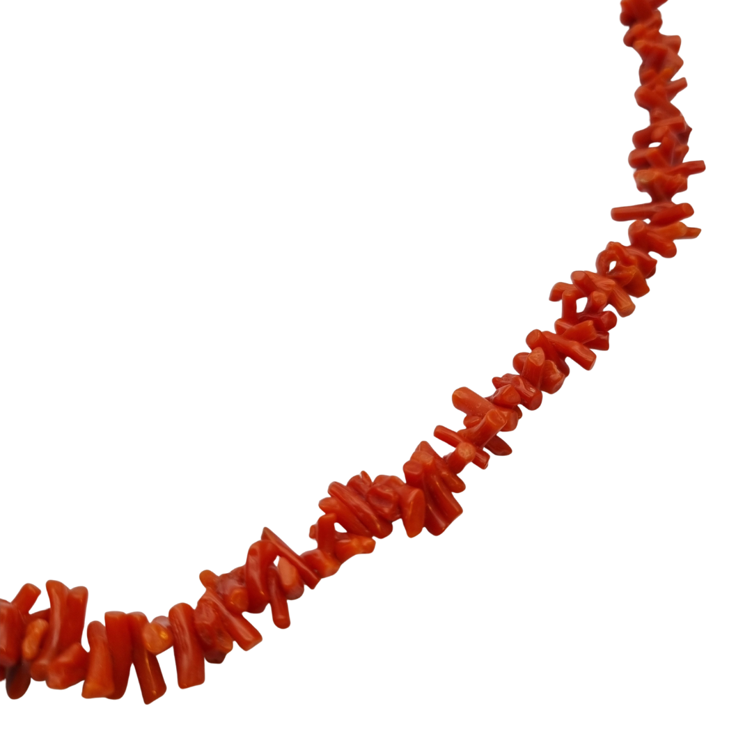 Boho necklace of natural red coral with irregular branches and metal clasp, circa 1970-80