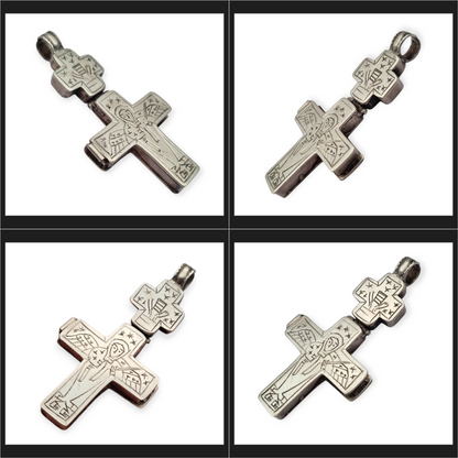 Antique Byzantine-style silver reliquary cross with engraved religious scenes.