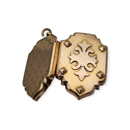 Victorian locket in gilt metal, engraved in the shape of a shield, circa 1900