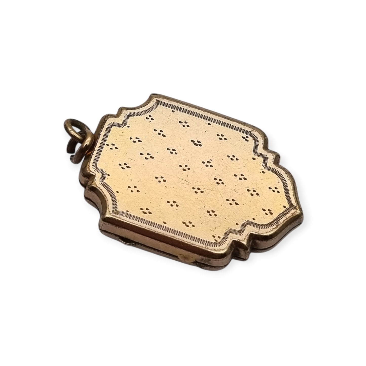 Victorian locket in gilt metal, engraved in the shape of a shield, circa 1900