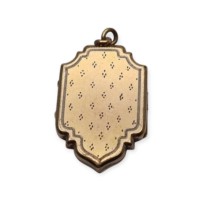 Victorian locket in gilt metal, engraved in the shape of a shield, circa 1900