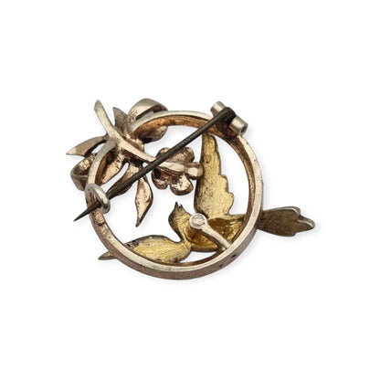 Broche eduardiano en plata con pájaro lazo perlas y rubí circa 1910