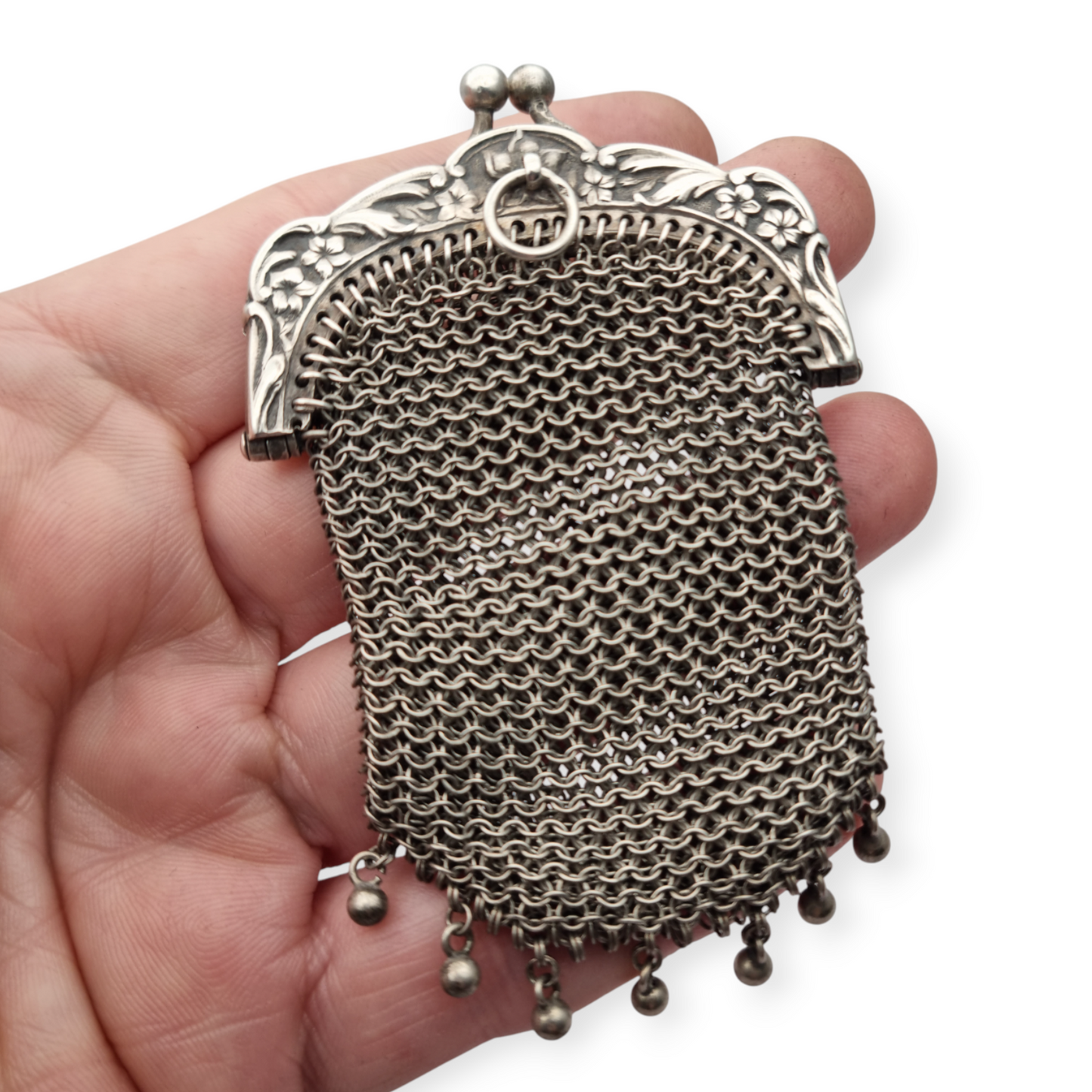 Art Nouveau silver coin purse with embossed floral clasp, circa 1900