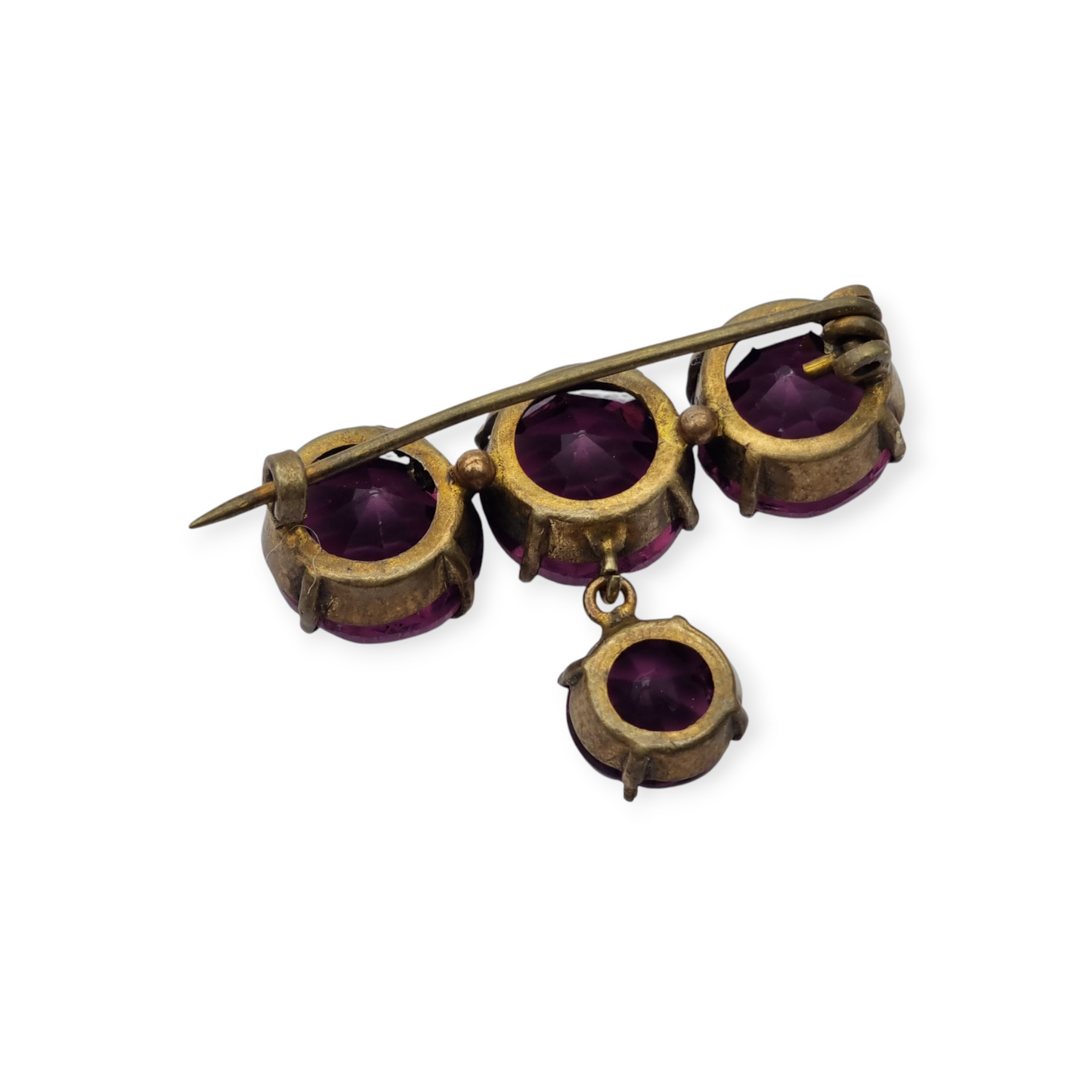 Broche antiguo en latón con strass morado facetado colgante, circa 1930