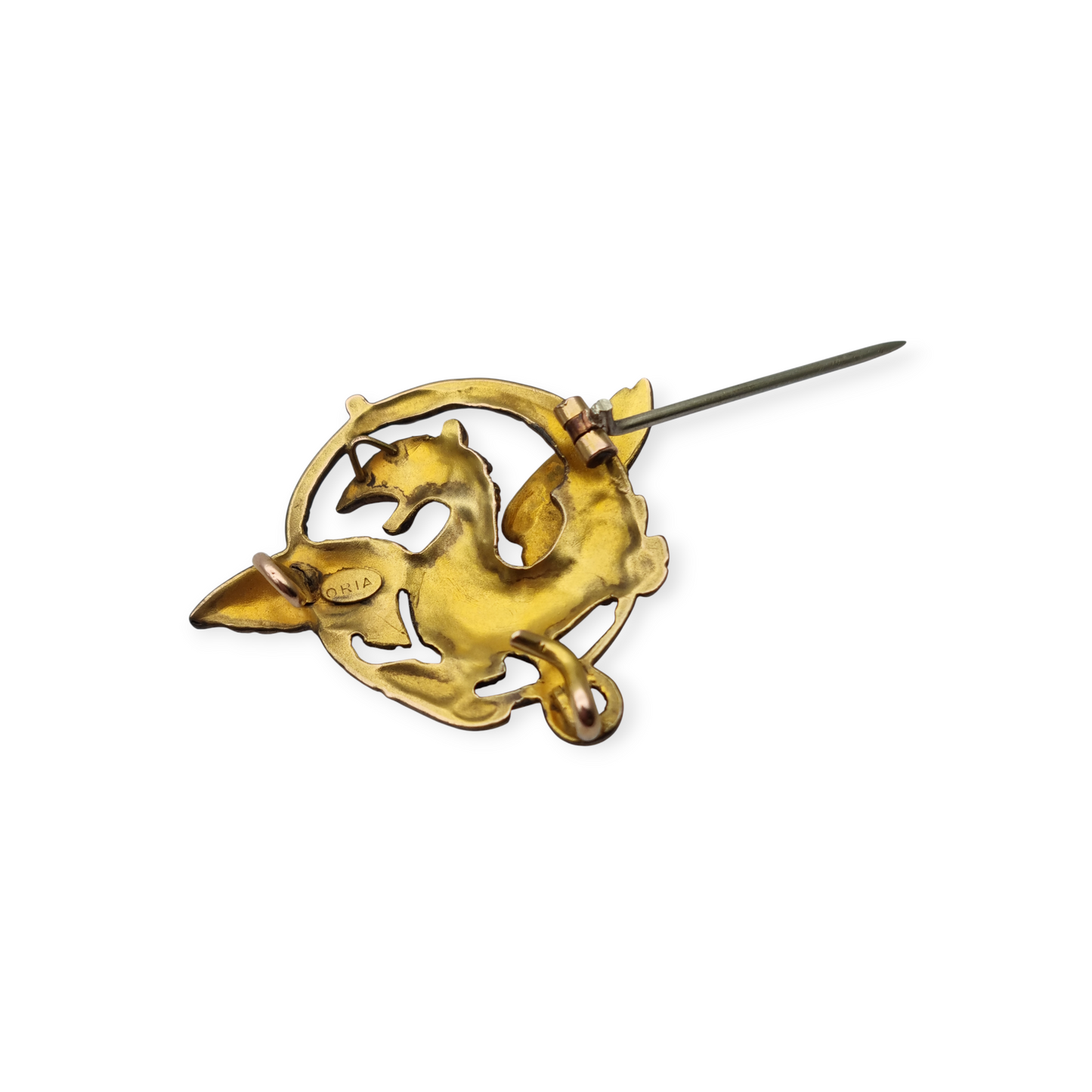 Broche Art Nouveau de grifo ORIA en oro laminado y ojo de rubí, circa 1910