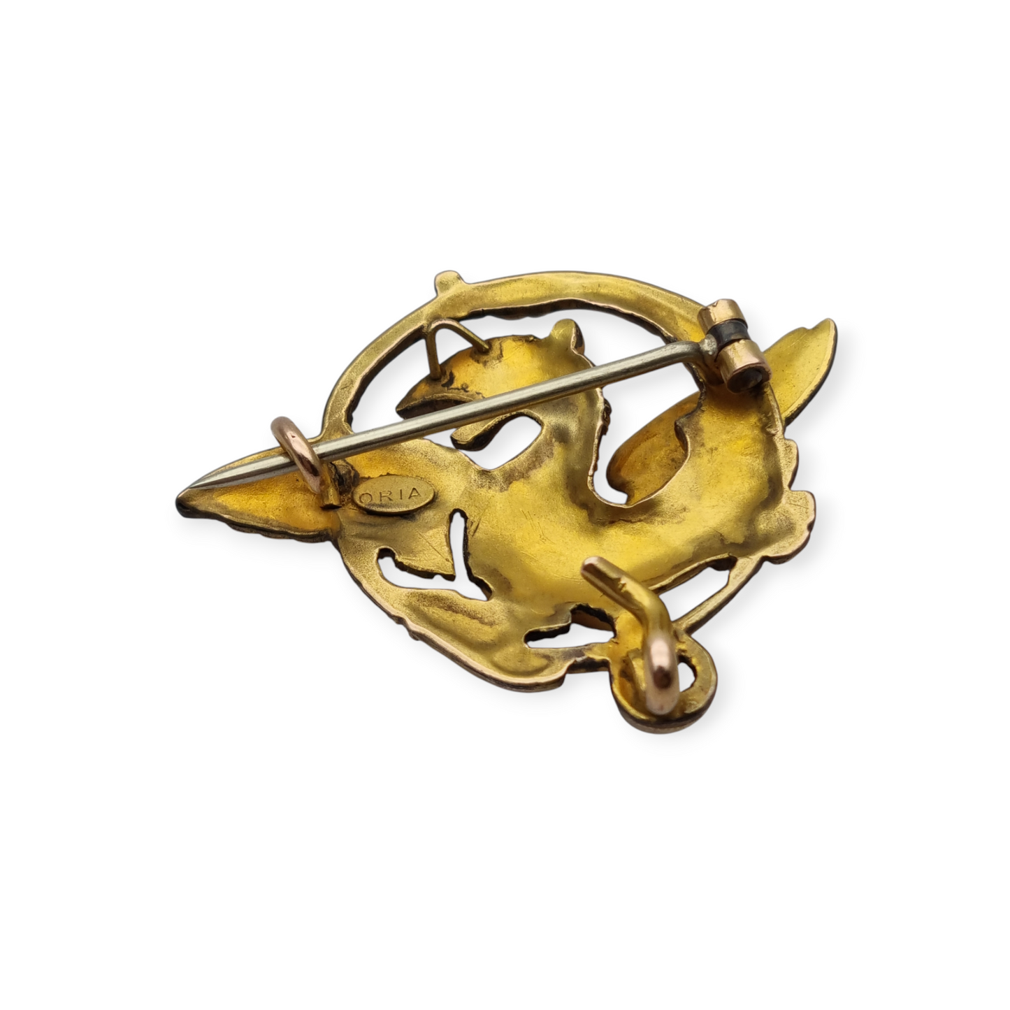 Broche Art Nouveau de grifo ORIA en oro laminado y ojo de rubí, circa 1910