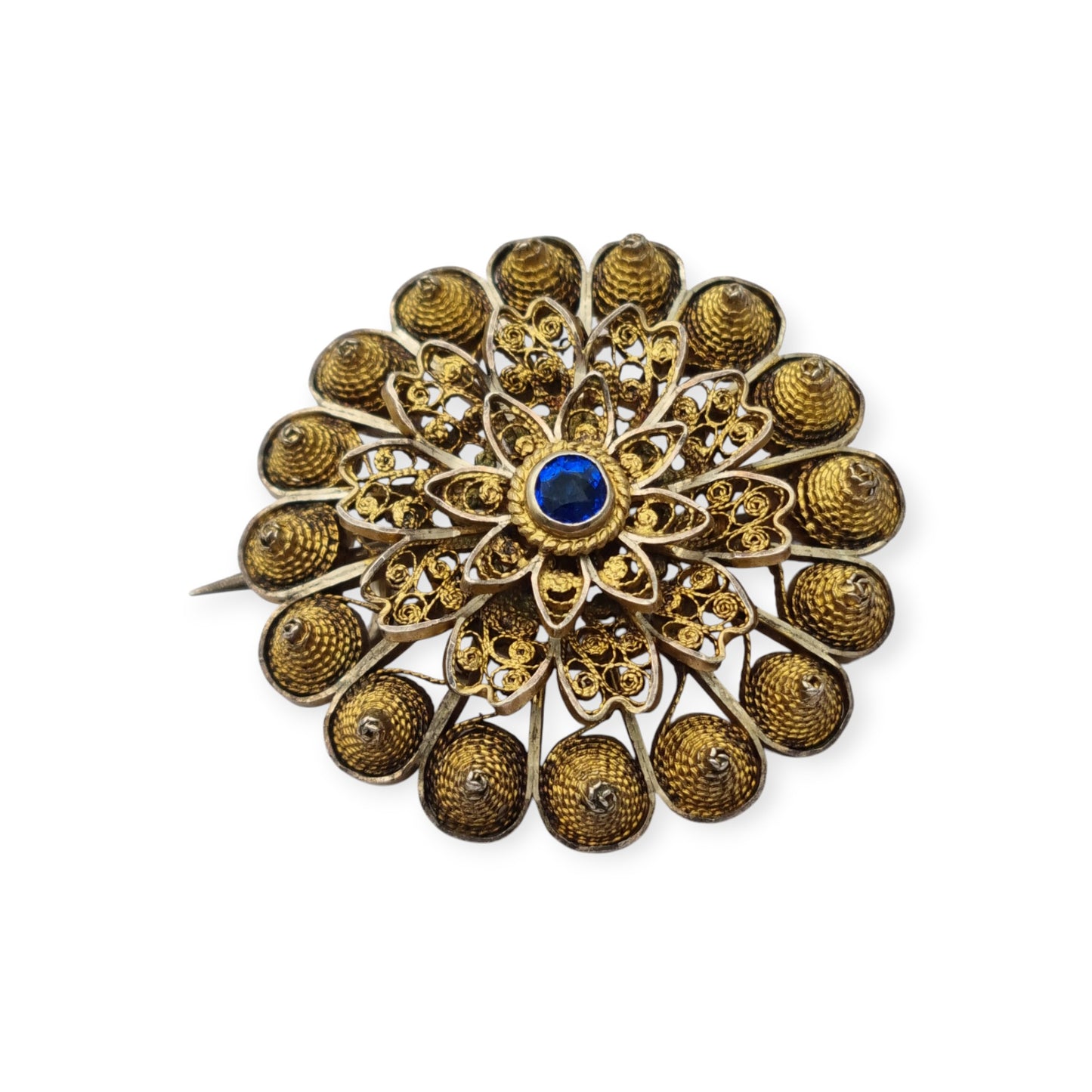Floral brooch from the 1930s-40s in gilded silver with blue crystal and oriental filigree