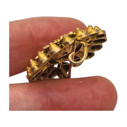 Floral brooch from the 1930s-40s in gilded silver with blue crystal and oriental filigree