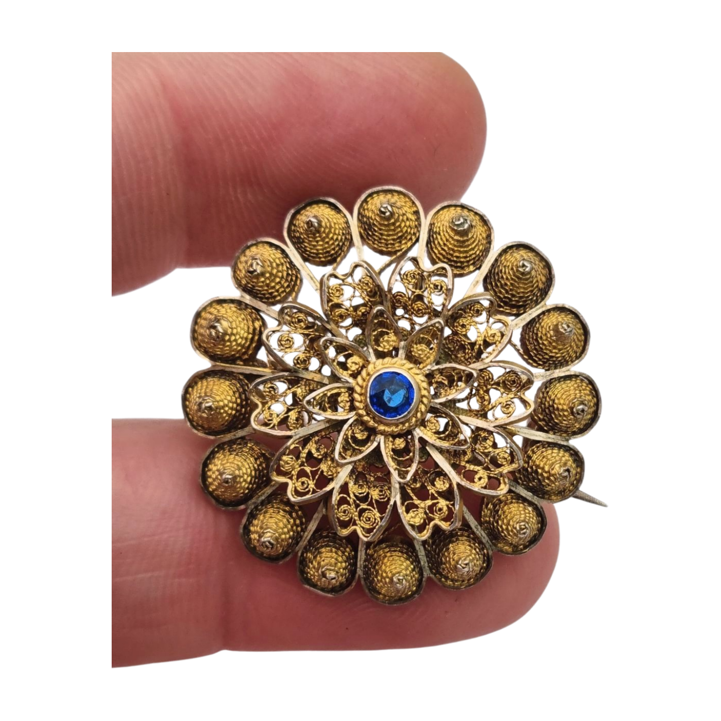 Floral brooch from the 1930s-40s in gilded silver with blue crystal and oriental filigree