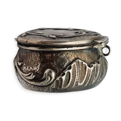 Art Nouveau silver chatelaine box with floral relief, signed JB, France, circa 1920.