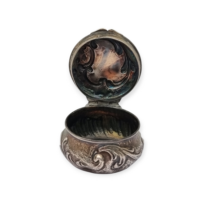 Art Nouveau silver chatelaine box with floral relief, signed JB, France, circa 1920.