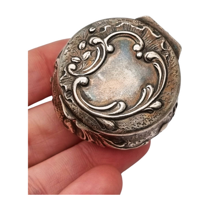 Art Nouveau silver chatelaine box with floral relief, signed JB, France, circa 1920.