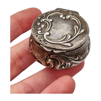 Art Nouveau silver chatelaine box with floral relief, signed JB, France, circa 1920.