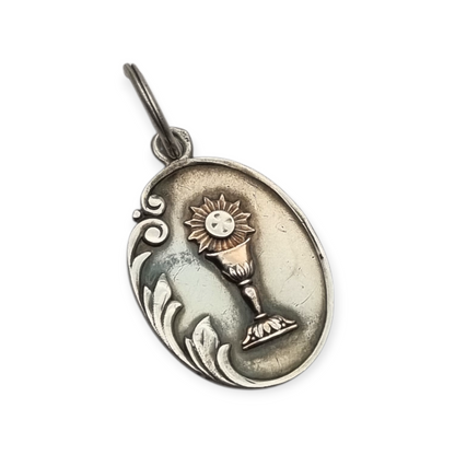Silver medal pendant with chalice and host, European Art Nouveau design circa 1905