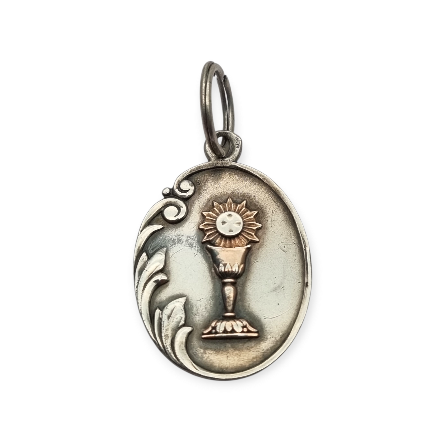 Silver medal pendant with chalice and host, European Art Nouveau design circa 1905