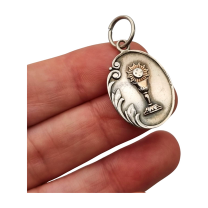 Silver medal pendant with chalice and host, European Art Nouveau design circa 1905