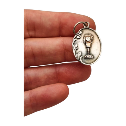 Silver medal pendant with chalice and host, European Art Nouveau design circa 1905