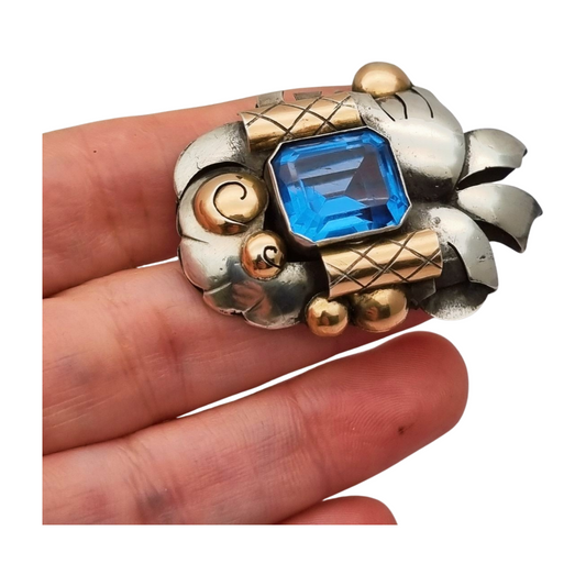 Art Deco Catalan brooch in silver with gold accents and simulated aquamarine, circa 1930-1940