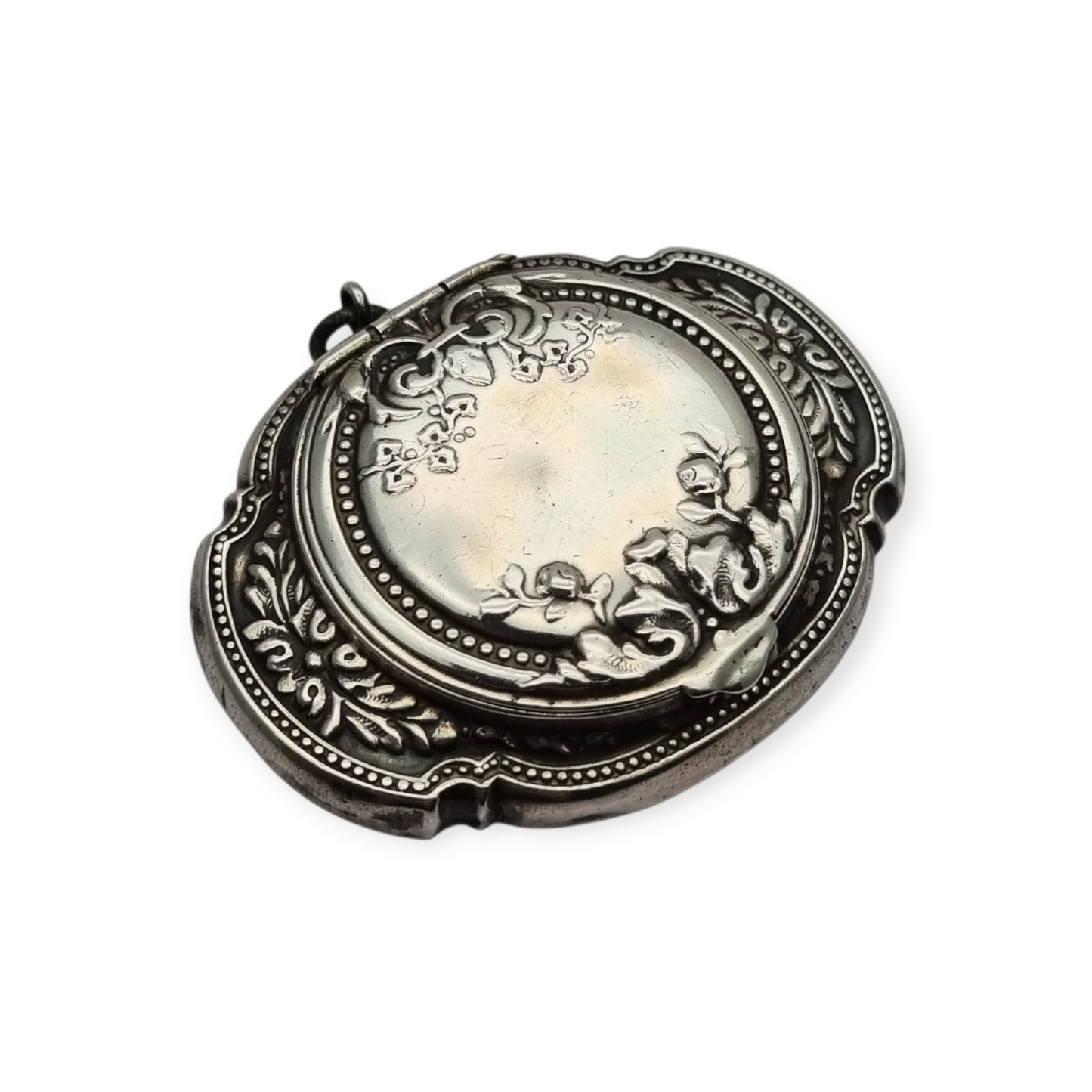 Antique Art Nouveau silver chatelaine powder compact with interior mirror, floral design, circa 1920.