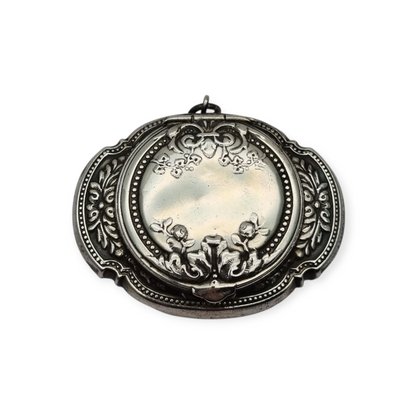 Antique Art Nouveau silver chatelaine powder compact with interior mirror, floral design, circa 1920.