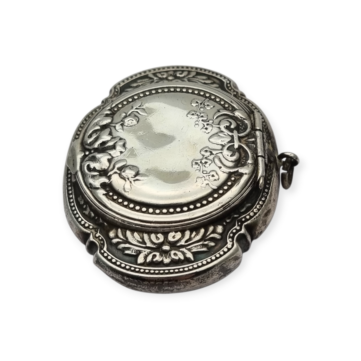 Antique Art Nouveau silver chatelaine powder compact with interior mirror, floral design, circa 1920.