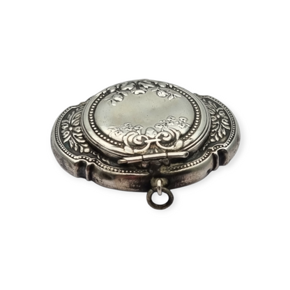 Antique Art Nouveau silver chatelaine powder compact with interior mirror, floral design, circa 1920.