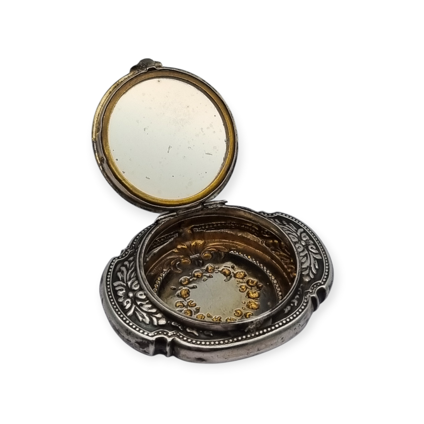 Antique Art Nouveau silver chatelaine powder compact with interior mirror, floral design, circa 1920.