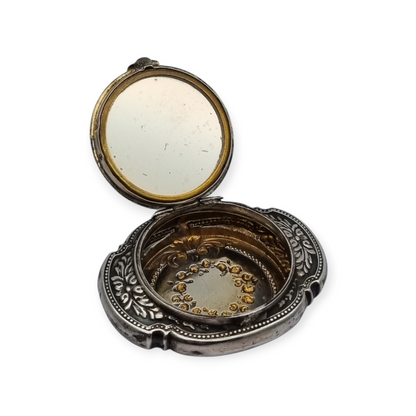 Antique Art Nouveau silver chatelaine powder compact with interior mirror, floral design, circa 1920.