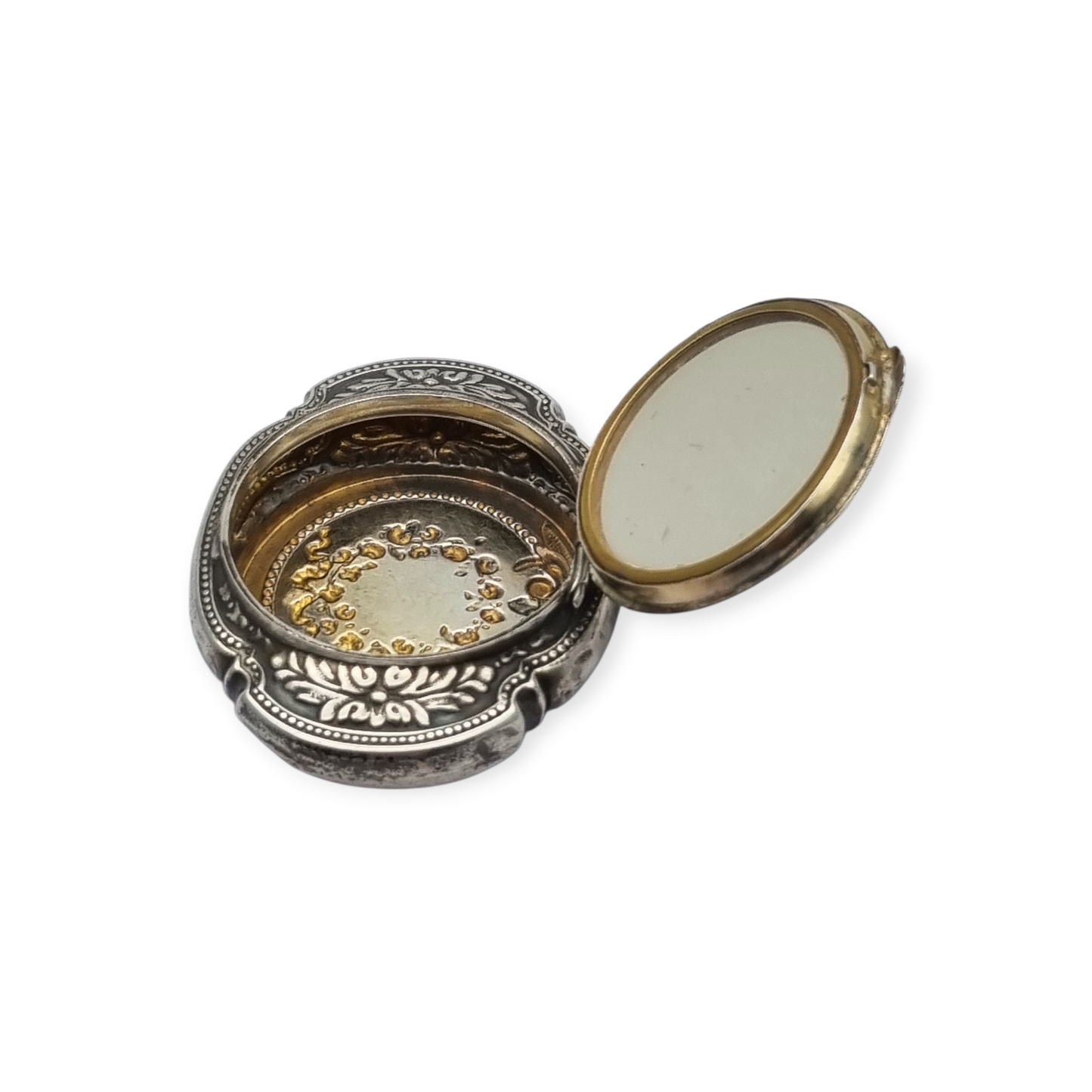 Antique Art Nouveau silver chatelaine powder compact with interior mirror, floral design, circa 1920.