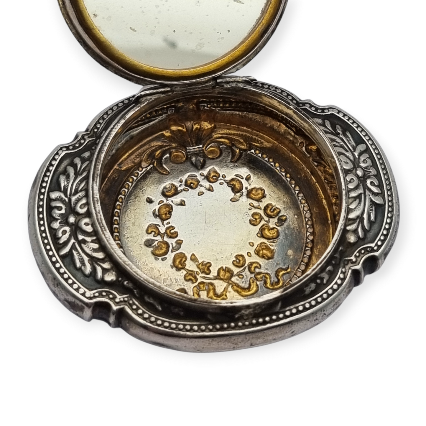 Antique Art Nouveau silver chatelaine powder compact with interior mirror, floral design, circa 1920.