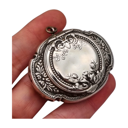 Antique Art Nouveau silver chatelaine powder compact with interior mirror, floral design, circa 1920.