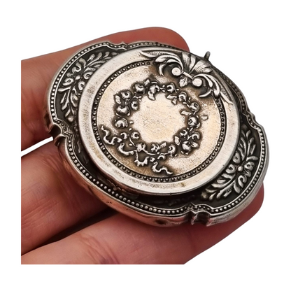 Antique Art Nouveau silver chatelaine powder compact with interior mirror, floral design, circa 1920.